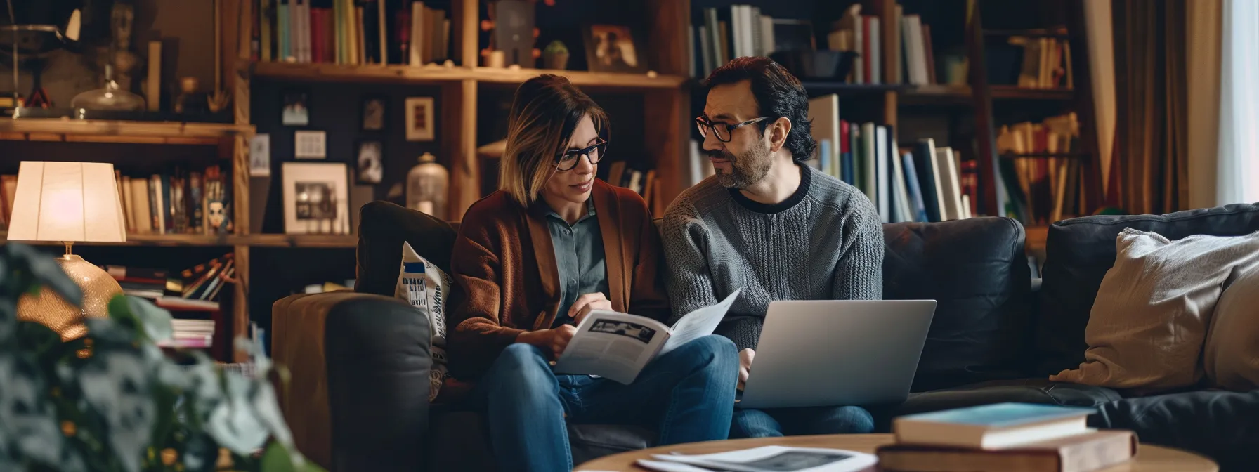 a couple sitting in a cozy living room, surrounded by brochures and laptops, comparing mortgage rates and lender options.